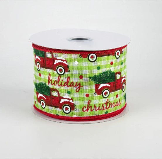 a roll of christmas ribbon with trucks on it