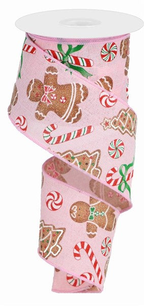 a pink ribbon with gingerbreads and candy canes on it