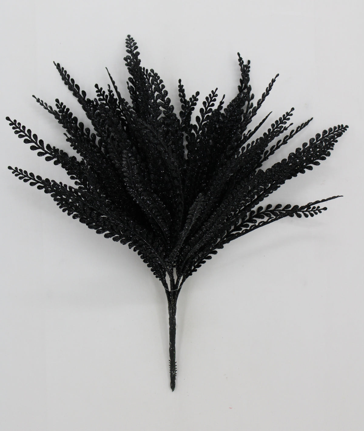 A bunch of black fake leaves or branches with a shiny, glittery appearance.
