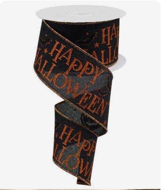 a roll of halloween ribbon with happy halloween written on it