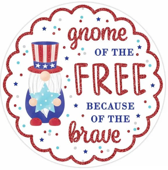 a gnome holding a star, surrounded by a patriotic design with red, white, and blue colors, and the text "gnome of the FREE because of the brave".