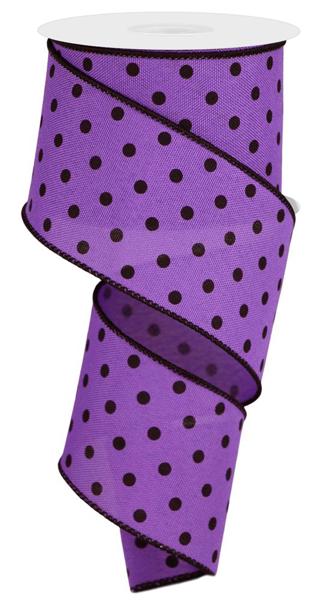 a purple ribbon with black polka dots on it
