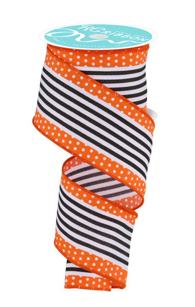 a roll of orange and black polka dot ribbon