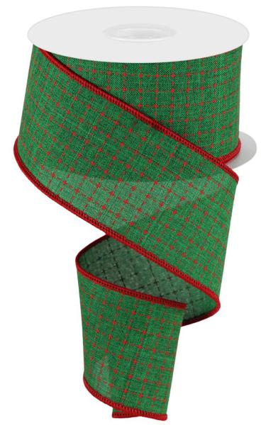 a roll of green and red plaid ribbon