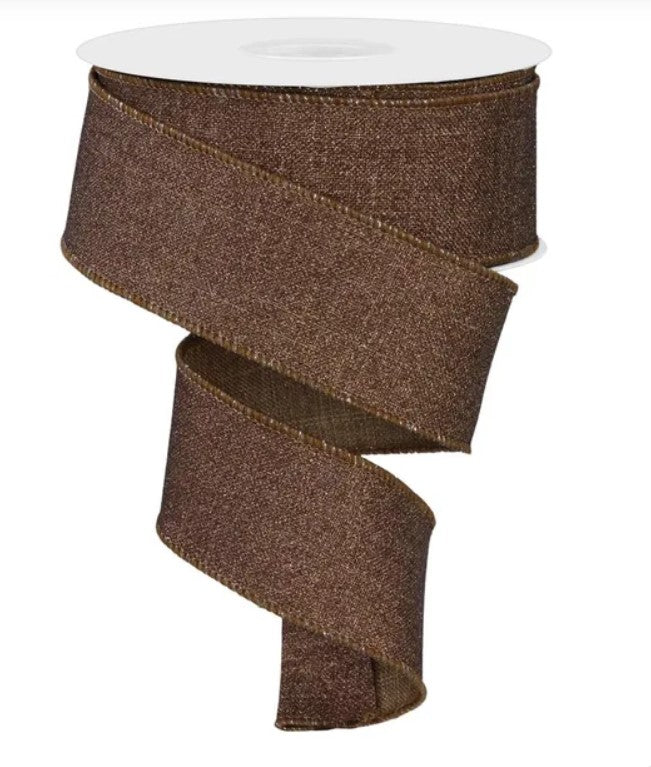a brown, textured ribbon that is coiled and twisted in a spiral pattern.