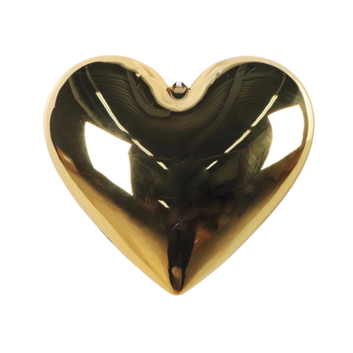 A shiny gold heart-shaped object is displayed against a white background.