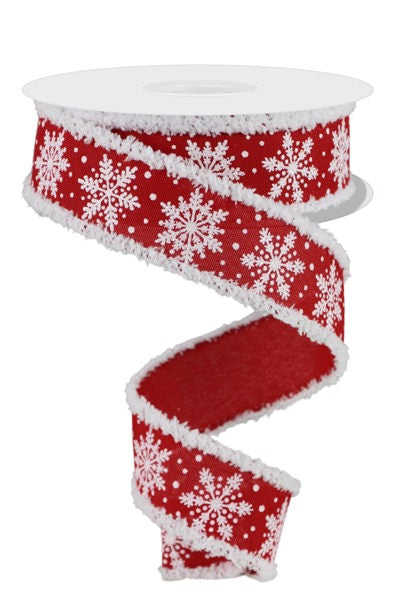a red and white ribbon with snowflakes on it