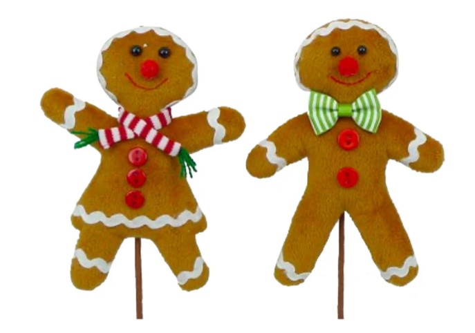 a couple of gingerbread man and woman on a stick