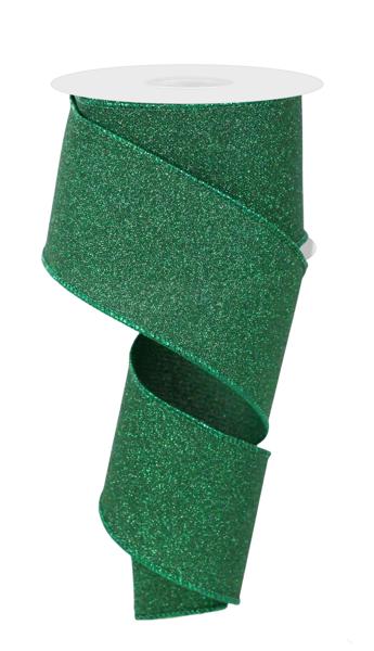 a roll of green glitter ribbon on a white background