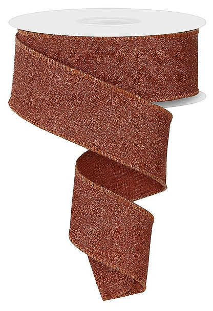 a roll of brown glittery ribbon with a spiral pattern.