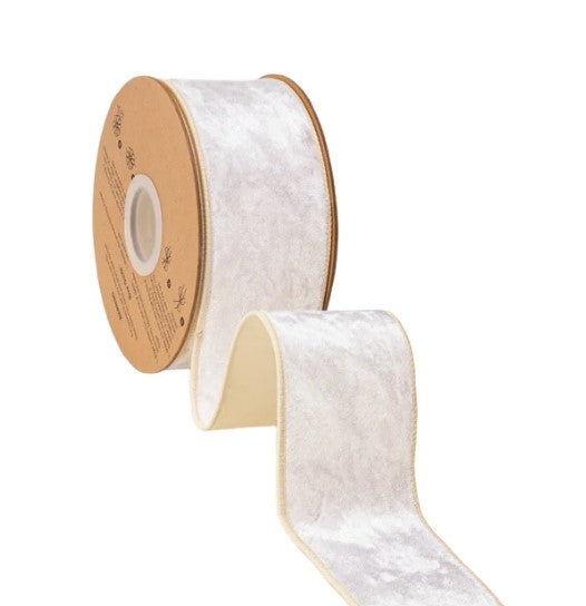 A roll of white velvet ribbon with a gold-colored border.