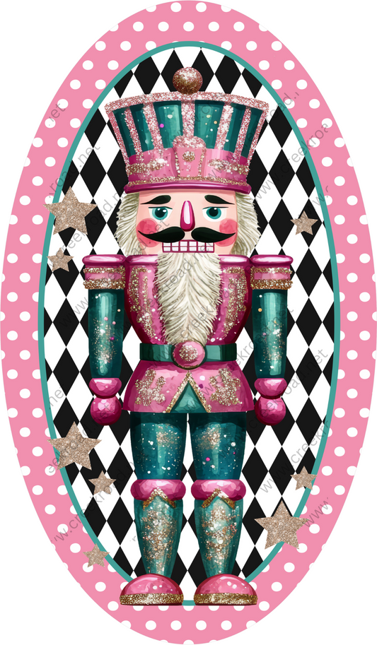 A colorful nutcracker figure wearing a pink and green outfit with gold accents, standing against a black and white polka dot background.