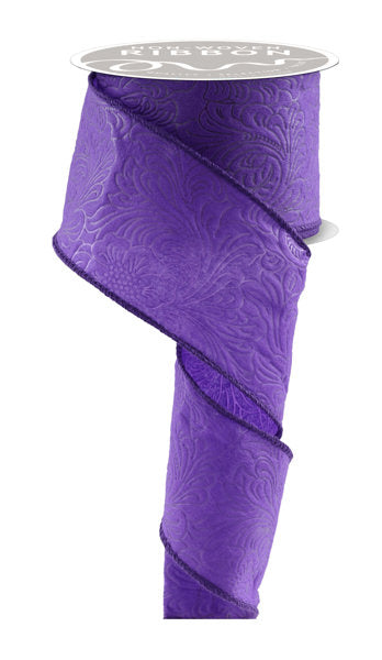 a roll of purple satin ribbon on a white background
