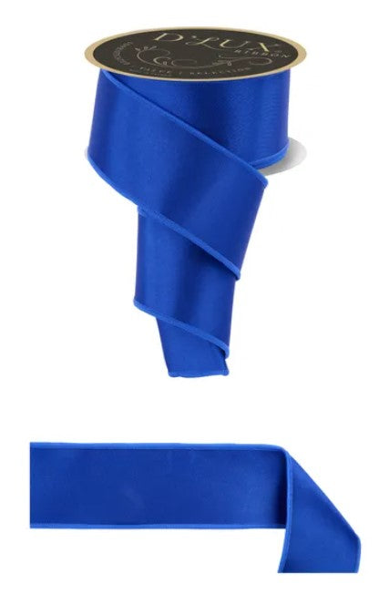 a roll of blue satin ribbon with a gold label.