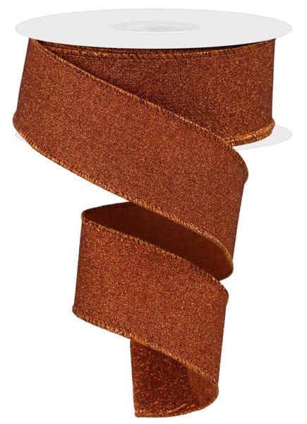 a roll of brown glitter ribbon on a white background