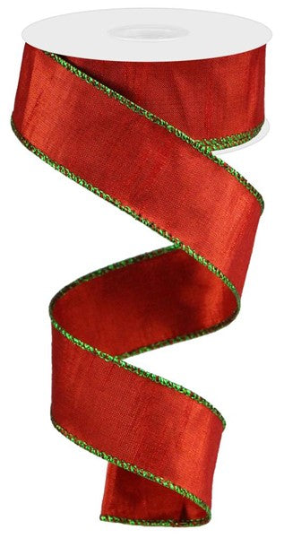 a red ribbon with green trim on a white background