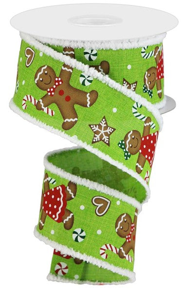 a roll of green christmas ribbon with gingers and gingerbreads on it