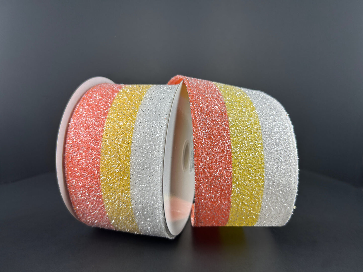 a roll of colorful tape sitting on top of a table