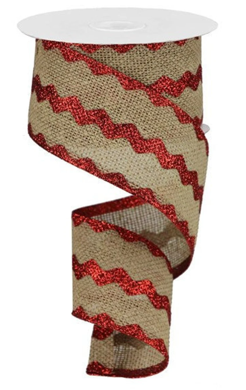 a roll of red and beige ribbon on a white background