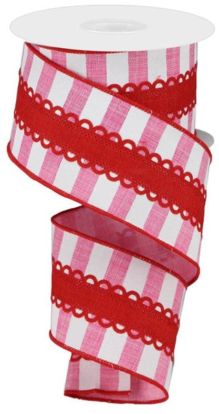 a roll of pink and white striped ribbon