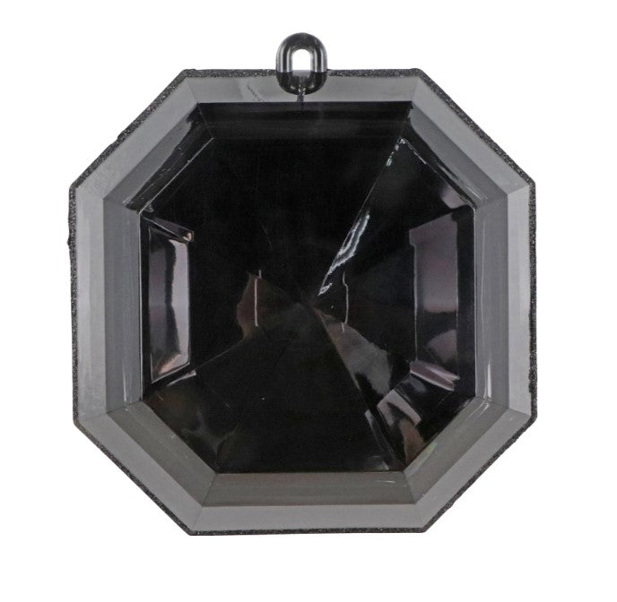 a large, black, octagonal glass object with a metallic frame.