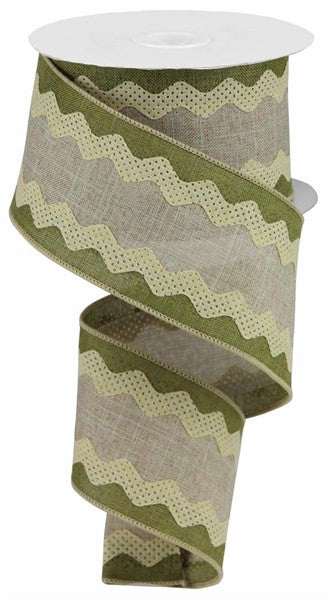 a roll of green and beige patterned ribbon