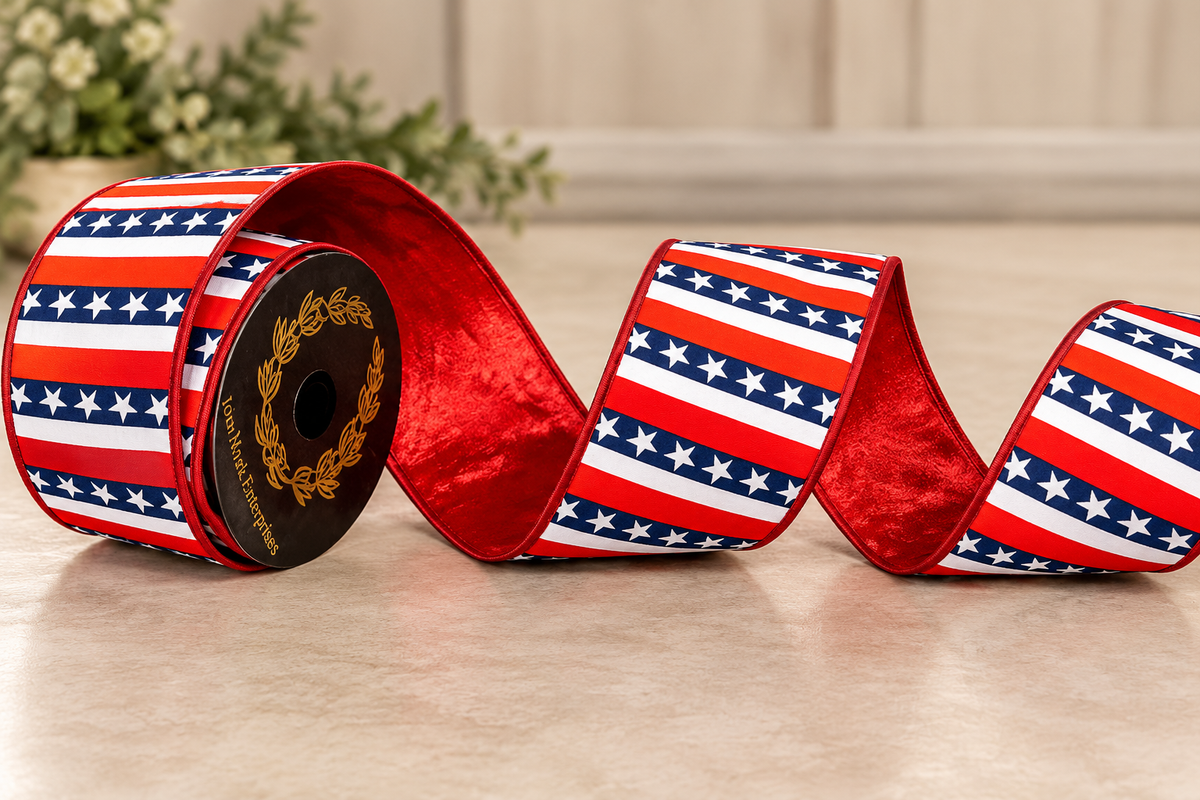 A roll of red and white ribbon with an American flag pattern is displayed on a wooden surface, with a plant in the background.