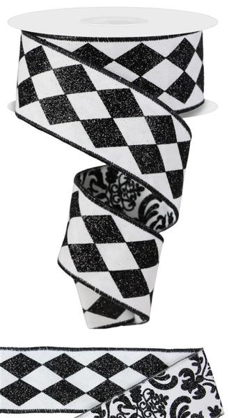 a roll of black and white ribbon with black and white designs