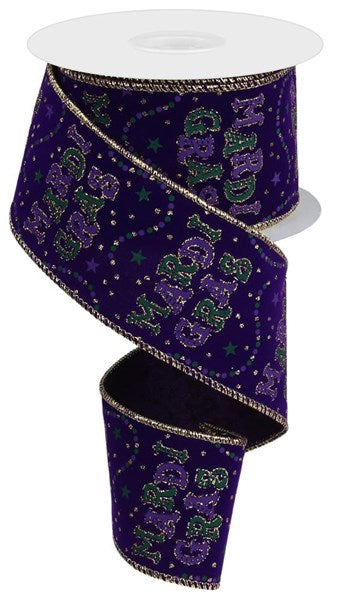 a roll of purple ribbon with green and purple letters