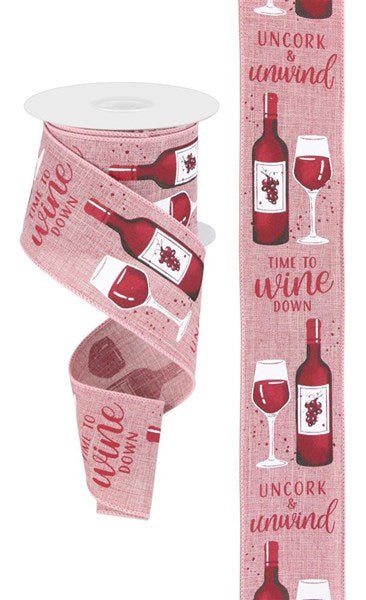 a pink ribbon with wine bottles and wine glasses on it