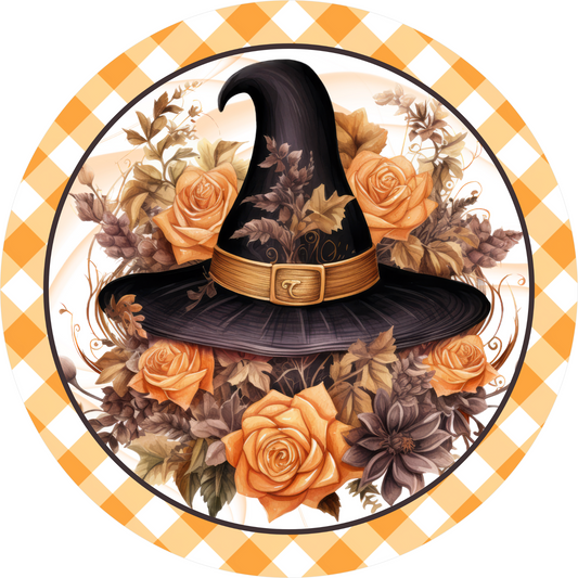 a witches hat with roses and leaves on a checkered tablecloth