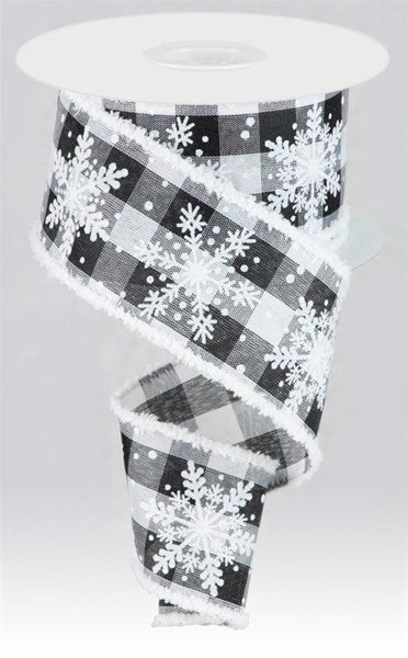 a roll of black and white snowflake ribbon
