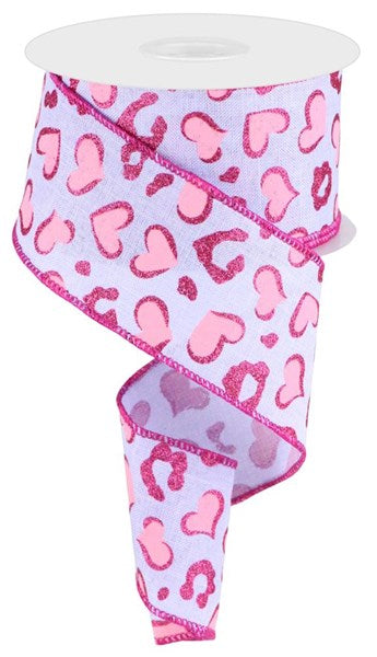 a pink and pink ribbon with hearts on it