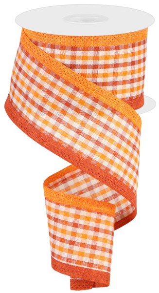 a roll of orange and white checkered ribbon
