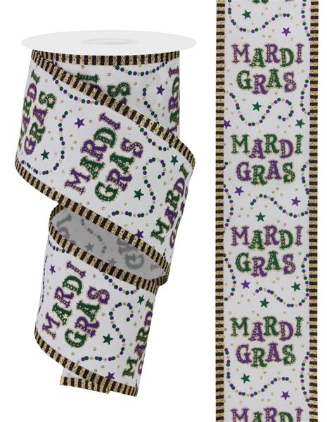 a roll of mardi gras ribbon next to a roll of mardi gr