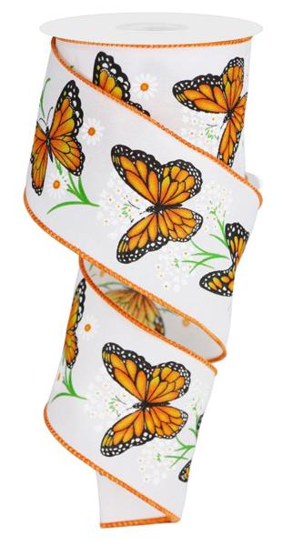 a roll of white ribbon with orange butterflies on it