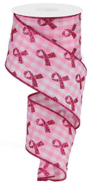 a roll of pink ribbon with pink bows on it