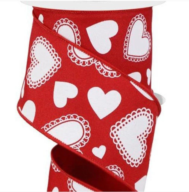 a red and white ribbon with hearts on it