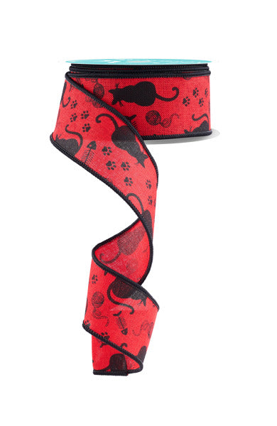 a red ribbon with black cats on it
