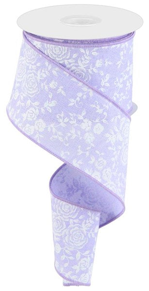 a purple ribbon with white flowers on it