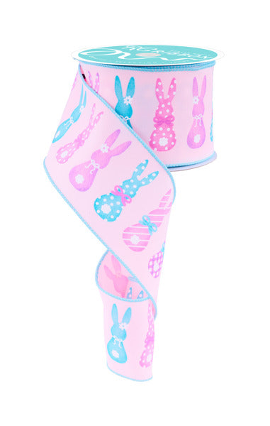 a pink cup with bunny ears on it