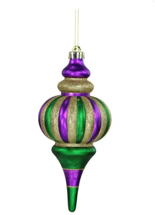 A decorative ornament with a pointed green and purple design, featuring gold and purple stripes.