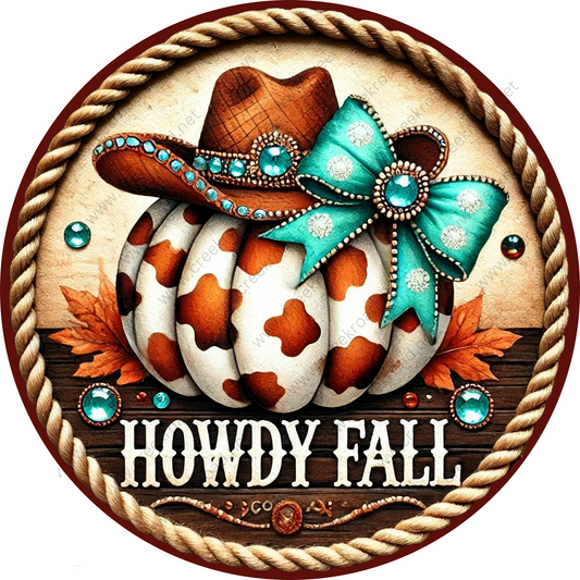 A decorative round sign with a cowboy hat, a spotted pumpkin, and a bow, surrounded by autumn leaves and rhinestones. The sign has the text "HOWDY FALL" written on it.