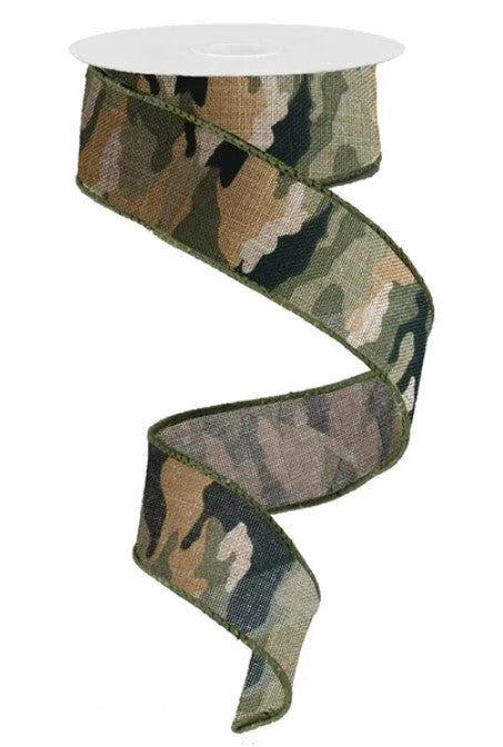 A camouflage-patterned ribbon is shown, with a white circular object at the top.