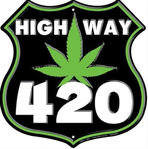 a highway sign with a marijuana leaf on it
