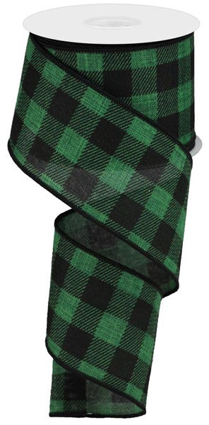 a roll of green and black plaid ribbon