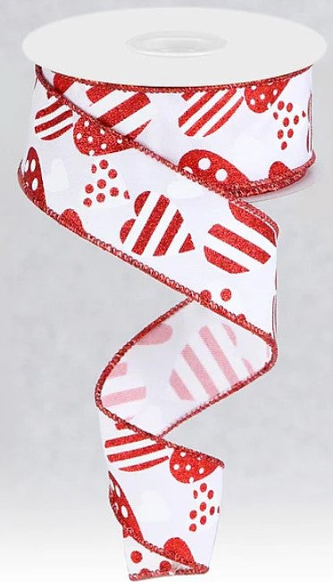 A red and white heart-shaped ribbon with a pattern of red hearts and white polka dots.