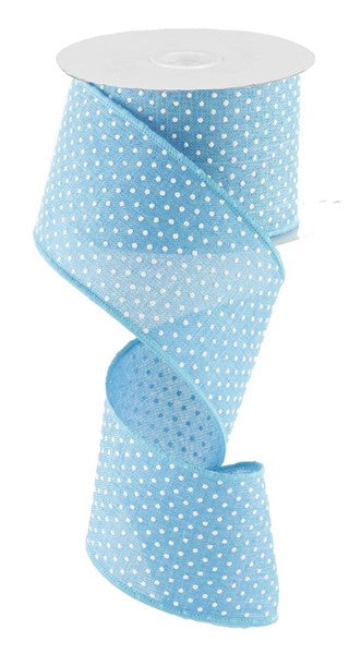 a roll of blue polka dot ribbon on a white background