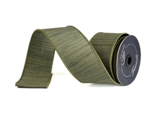 A roll of green fabric ribbon with a black spool of ribbon at the end, set against a white background.
