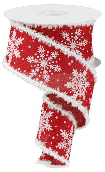 a roll of red and white christmas ribbon with snowflakes on it